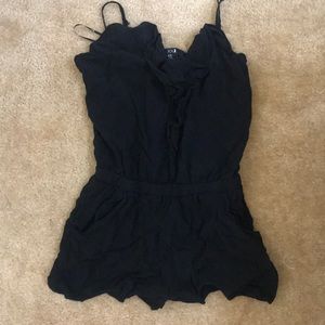 Black romper with ruffled front